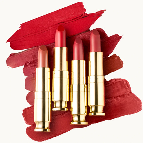 Set of red lipsticks with gold casings