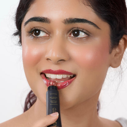 Berry_Rush Indian woman with fair skin applying Glazient Berry Rush berry red lip gloss