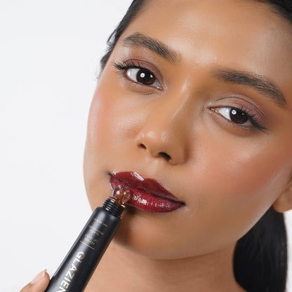 Dark_Cocoa Indian woman with medium skin applying Glazient Dark Cocoa brown lip gloss