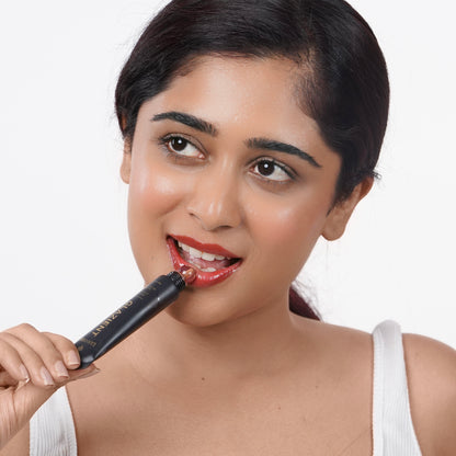 Toasted_Nude Indian woman with fair skin applying Glazient Toasted Nude nude lip gloss